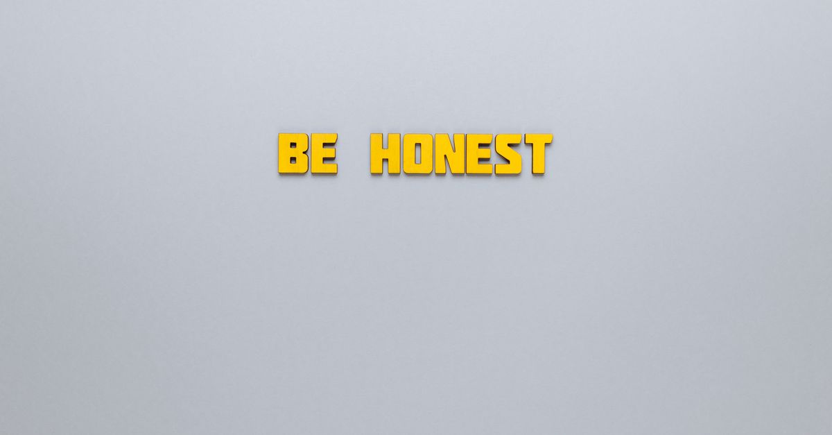 Simple yellow text 'Be Honest' on a neutral background, emphasizing clarity and inspiration.